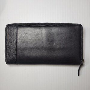 GUCCI  embossed leather logo zip around long wallet black